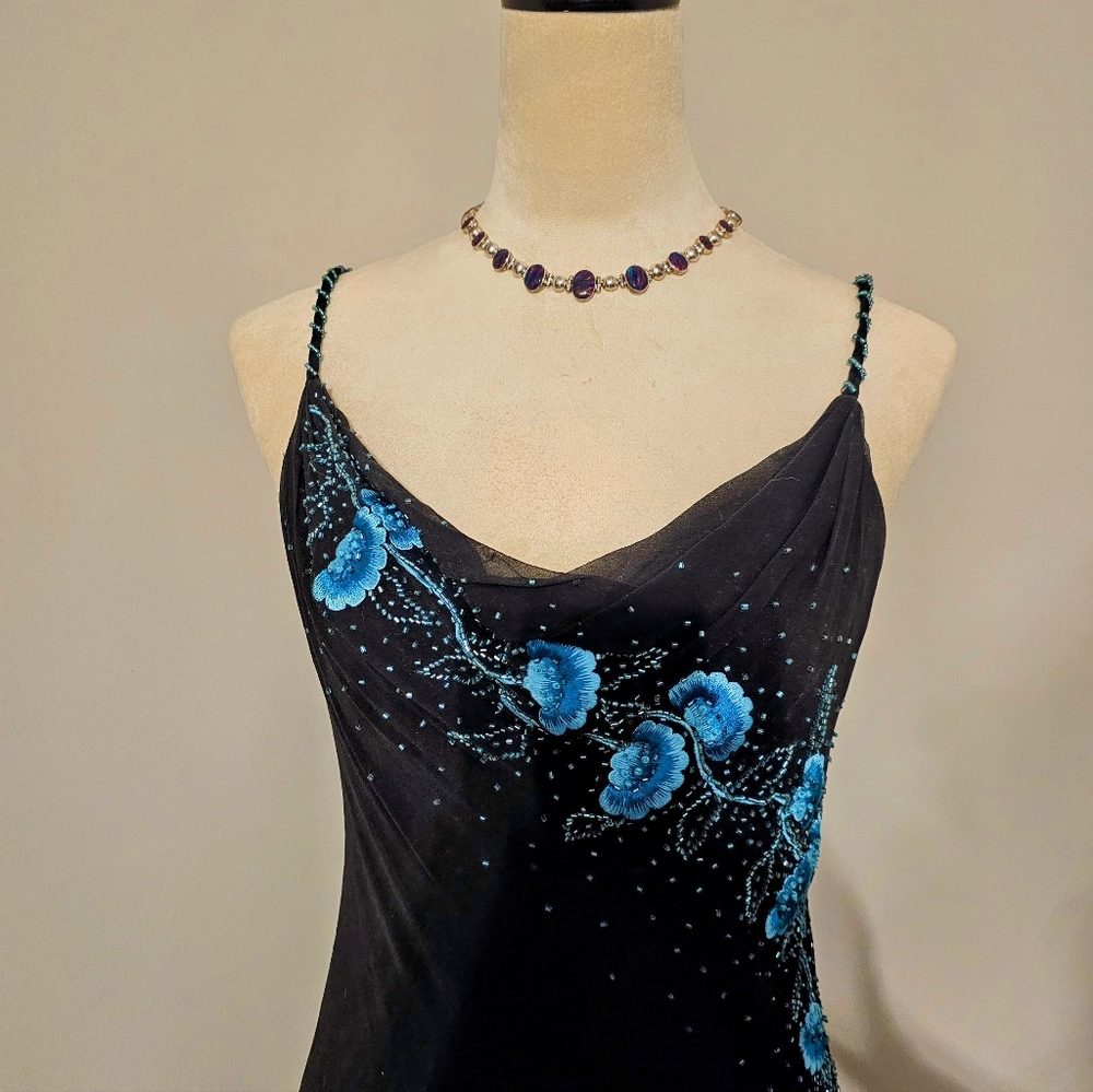 Xscape Floral Beaded Mermaid Silhouette Formal Gown.